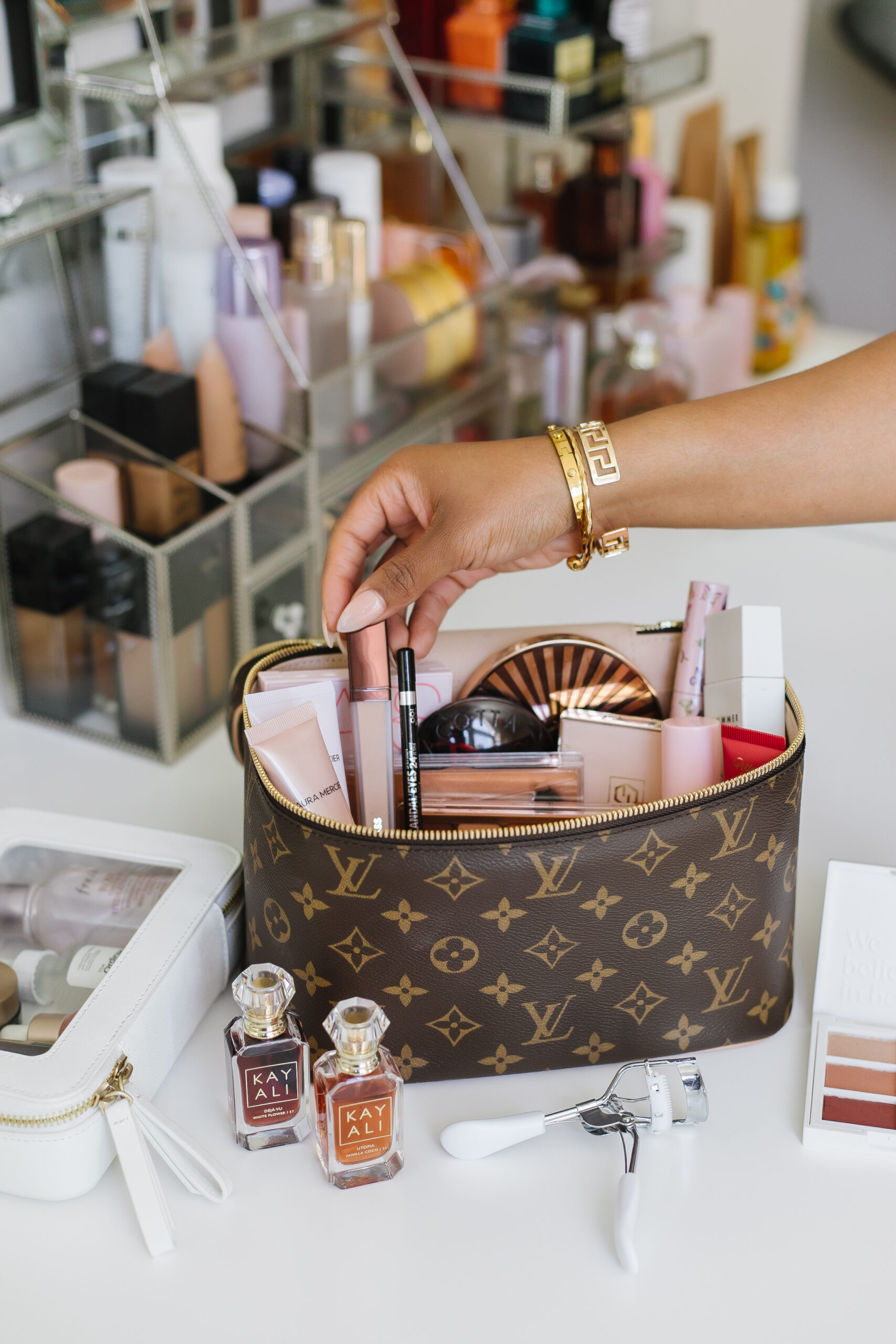 TRAVEL MAKEUP BAG ESSENTIALS  WHAT'S IN MY LOUIS VUITTON TOILETRY